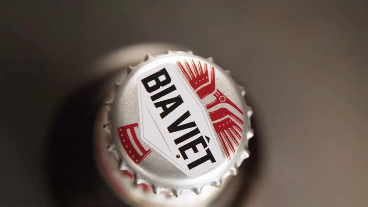 Macro of a bottle cap turning against a warm gradient, shot on the table-top stage